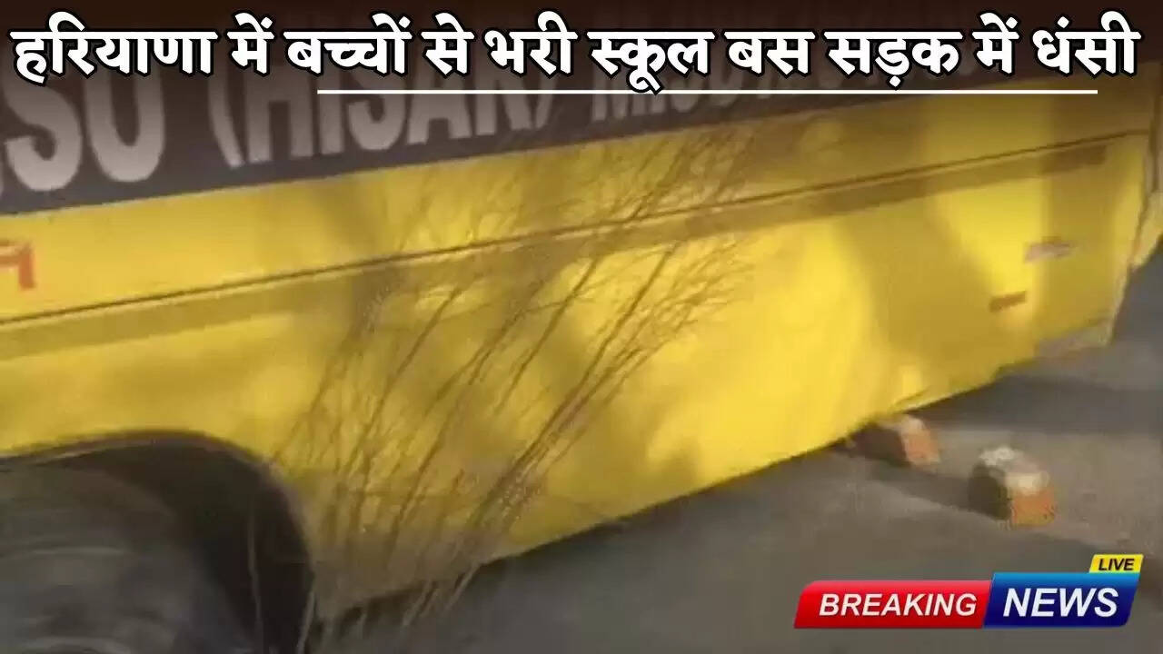 A school bus full of children sinks in the road in Haryana